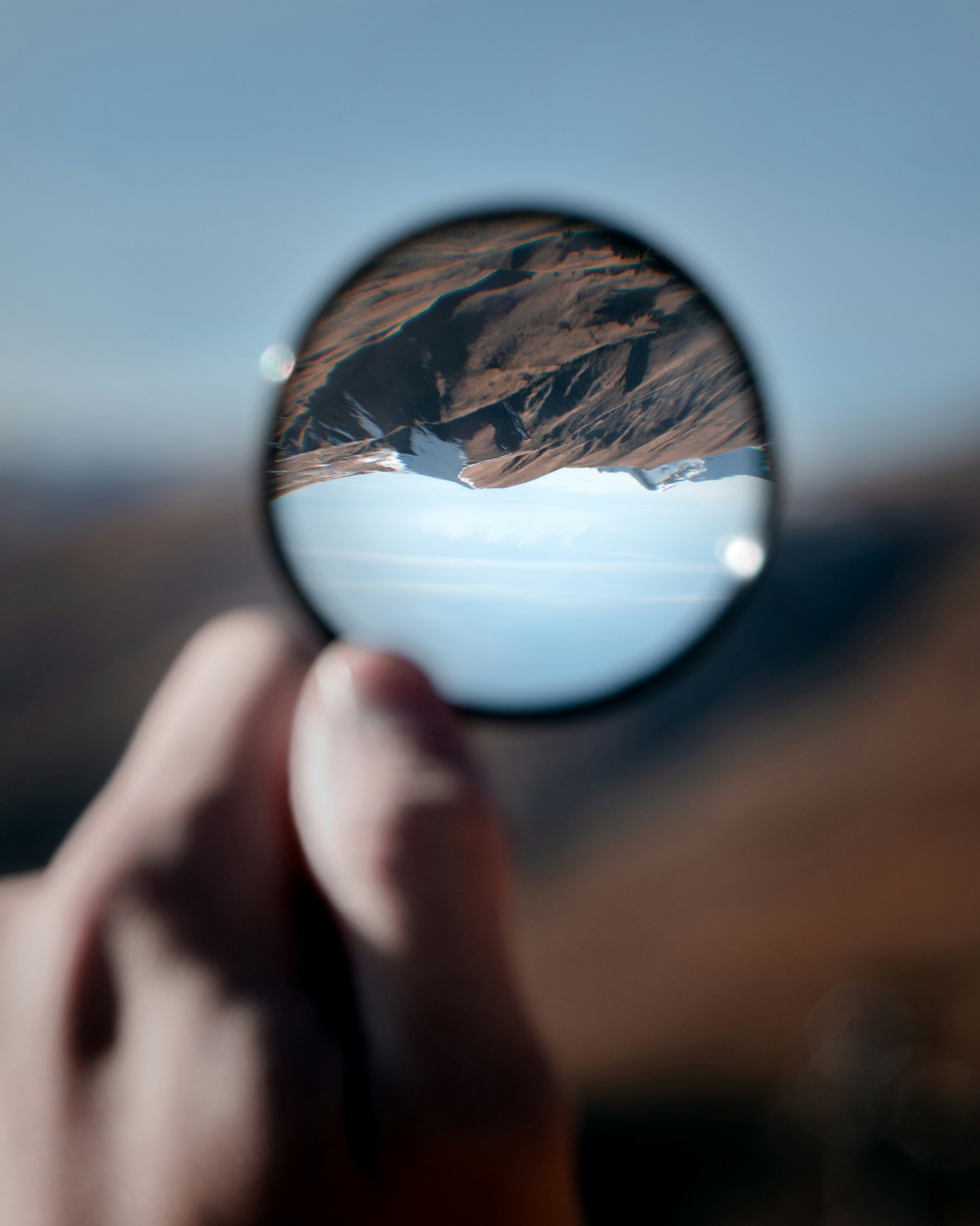 image of a mountain through a lens